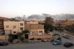Smoke billows from buildings during clashes between Libyan security forces and armed Islamist groups in the eastern coastal city of Benghazi on August 23, 2014.  By Abdullah Doma AFPFile