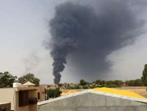 A picture taken on July 28, 2014 shows smoke billowing from an oil depot where a huge blaze started following clashes around Tripoli airport, in the south of the city.  By Mahmud Turkia AFP