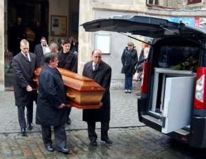 Funeral service employees carry coffins of Gerald Fontaine and Johanna Delahaye, on May 5, 2012, murdered in Madagascar.  By Christian Eletufe AFPFile