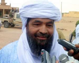 Ansar Dine Islamist group leader Iyad Ag Ghaly, answers journalists' question on August 7, 2012 at the Kidal airport, in northern Mali.  By Romaric Hien AFP