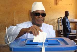 Mali President Ibrahim Boubacar Keita casts his vote at a polling station in Bamako, on November 24, 2013.  By Habibou Kouyate (AFP)