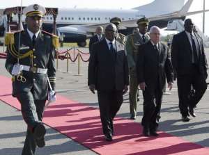 Mali President Ibrahim Boubacar Keita L, who is on a three-day visit to Algiers, walks alongside President of the Algerian Senate, Abdelkader Bensalah, upon arriving in the capital Algiers on March 22, 2015.  By Farouk Batiche AFPFile