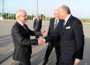 French Foreign Minister Laurent Fabius R is welcomed by Algerian Foreign Minister Mourad Medelci.  By Farouk Batiche AFP