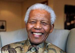 A TV clip today showed Nelson Mandela flanked by his wife Graca Machel.  By Debbie Yazbek AFPMandela FoundationFile