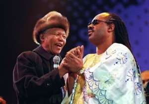 Nelson Mandela left with Stevie Wonder at a concert in Johannesburg on July 25, 1998 to mark Mandela's 80th birthday.  By Walter Dhladhla AFPFile