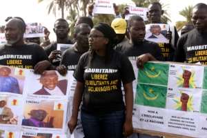 Anti-slavery activists demonstrate in Dakar, Senegal, against the imprisonement of fellow activists in Mauritania, on August 3, 2016.  By Seyllou AFPFile