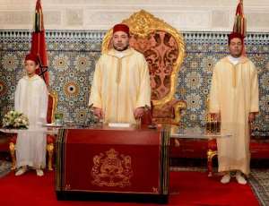 A handout picture released by the Moroccan Royal Palace shows Morocco's King Mohammed VI C delivering a speech marking the 15th anniversary of his coronation, on July 30, 2014, in Rabat.  By  Moroccan Royal PalaceAFP