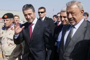 NATO chief Anders Fogh Rasmussen waves upon arrival at Tripoli airport.  By Marco Longari (AFP)
