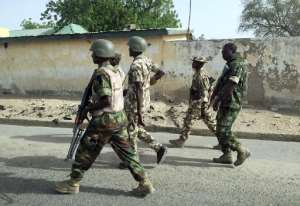 A photo released by the Nigerian Army shows soldiers in Goniri on March 16, 2015. By (Nigerian army/AFP/File)