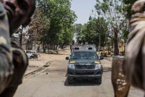 Troops patrol in the city of Bama, northeast Nigeria, on March 25, 2015.  By Nichole Sobecki AFPFile