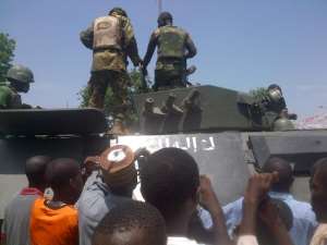 Troops stand on an armored personnel carrier APC recovered from Boko Haram insurgents in Konduga on September 16, 2014.  By Tunji Omirin AFPFile