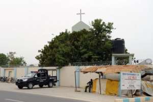 Nigerian police guard a checkpoint next to a Christian church in the northeastern city of Maiduguri, on May 13, 2012. By Pius Utomi Ekpei (AFP/File)
