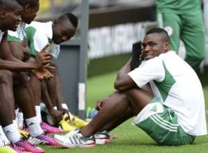Nigeria's forward Emmanuel Emenike R and teammates prepare for a training session in Soweto on February 9, 2013.  By Francisco Leong AFP