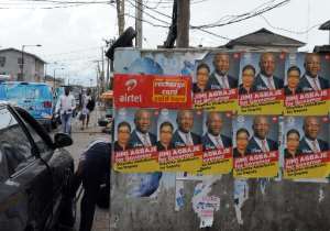 Campaign posters for the Lagos gubernatorial candidate from the opposition People's Democratic Party, Jimi Agbaje, are seen on March 10, 2015 in Lagos.  By Pius Utomi Ekpei AFP