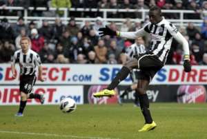 Newcastle United's Senegalese striker Papiss Cisse scores at St James' Park on March 10, 2013.  By Graham Stuart AFP