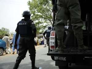 Nigerian police patrol the northern town of Bauchi in April 28, 2011.  By Tony Karumba AFPFile