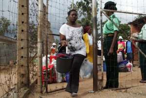 File photo shows prisoners walking free out of Chikurubi prison in Zimbabwes capital Harare on February 17, 2014 following a presidential pardon. By Jekesai Njikizana (AFP/File)