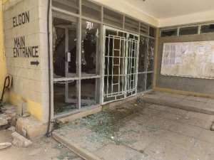 Smashed glass doors seen at the main entrance to Garissa University in Garissa, Kenya, where Islamist gunmen massacred 148 people, on April 6, 2015.  By Adow Jubat AFPFile