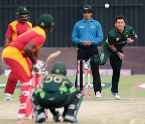 Yasir Shah right delivers a ball against Zimbabwe in Harare on October 1, 2015 during the first in a series of three ODIs.  By Jekesai Njikizana AFP
