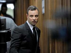 South African paralympian Oscar Pistorius arrives at the High Court in Pretoria for his trial on July 2, 2014.  By Werner Beukes POOLAFP