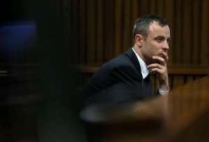 South African sprinter Oscar Pistorius reacts during his trial at the North Gauteng High Court in Pretoria on April 15, 2014.  By Alon Skuyi PoolAFP