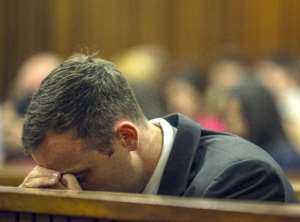 South African paralympic athlete Oscar Pistorius rests his head on October 17, 2014 during his sentencing hearing at the North Gauteng High Court in Pretoria.  By Mujahid Safodien PoolAFPFile