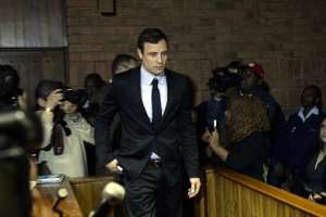 Oscar Pistorius arrives at the Magistrate Court in Pretoria on August 19, 2013.  By Stephane de Sakutin AFPFile