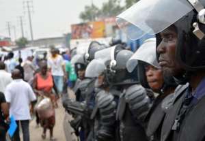 Police stand guard following demonstrations in Kinshasa on January 12, 2015.  By Papy Mulongo AFPFile