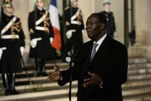 Ivory Coast's President Alassane Ouattara makes a statement following his meeting with the French President on February 4, 2016 at the Elysee Presidential Palace in Paris.  By Stephane de Sakutin AFP