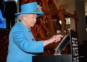Queen Elizabeth sends her first tweet during a visit to open the 'Information Age' exhibition at the Science Museum in London on October 24, 2014.  By Chris Jackson PoolAFPFile