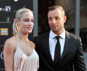 Steenkamp and Pistorius are seen at Feather Awards in Johannesburg on November 4, 2012.  By Lucky Nxumalo AFPFile