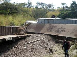 This picture taken on April 22, 2014 shows derailed wagons after a train sped off the rails in the southern province of Katanga, Democratic Republic of Congo.  By Numbi Mathys AFP
