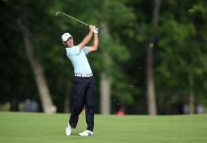 Charl Schwartzel of South Africa hits his second shot on the par 4 13th hole on May 30, 2013, in Dublin, Ohio.  By Andy Lyons Getty ImagesAFP