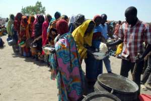 Internally Displaced People queue to be served with food at Dikwa Camp in Borno State in north-eastern Nigeria on February 2, 2016.  By  AFPFile