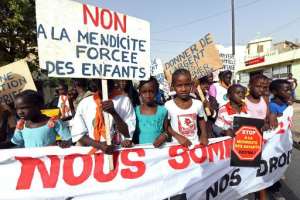 Children protest against the practice of forced begging on March 3, 2015 in Dakar, Senegal.  By Seyllou AFPFile