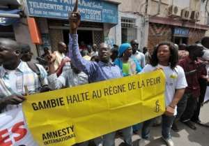 Protesters gather outside the Gambian embassy in Senegal.  By Seyllou AFP