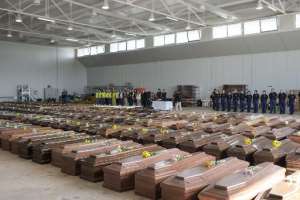 Coffins containing the bodies of the shipwreck victims in a hanger in Lampedusa on October 9, 2013.  By Roberto Salomone European CommissionAFP