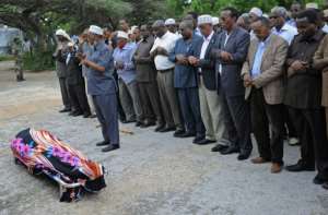 Somali lawmakers and relatives pray over the body of slain MP Mohamed Ahmed Gurhan during his funeral in Mogadishu, on November 8, 2015.  By Mohamed Abdiwahb AFP