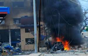 Scene of a car bomb attack claimed by Al-Qaeda-affiliated Shabaab militants on the Naasa Hablood hotel in Mogadishu on June 25, 2016 which killed at least 11 people.  By Mohamed Abdiwahab AFP