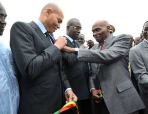 Karime Wade (left) has been a divisive figure in Senegalese politics.  By Seyllou Diallo (AFP/File)
