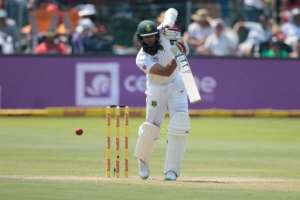 South Africa batsman Hashim Amla plays a shot on the first day of the first Test against Sri Lanka at the Port Elizabeth cricket ground in Port Elizabeth on December 26, 2016.  By GIANLUIGI GUERCIA AFPFile