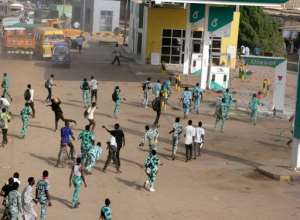 Sudanese protestors throw stones at a petrol station in Khartoum's twin city of Omdurman on September 25, 2013 during a demonstration after the government announced steep price rises for petroleum products after suspending state subsidies.  By  AFPFile