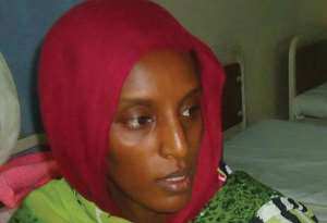 Meriam Yahia Ibrahim Ishag, sits in a cell at a women's prison in Khartoum's twin city of Omdurman on May 28, 2014.  By  AFPFile