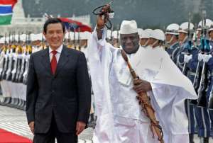 In this file photo, visiting Gambian President Yahya Jammeh R is seen being accompanied by his Taiwanese counterpart Ma Ying-jeou, during a welcoming ceremony in Taipei, on April 21, 2009.  By Patrick Lin AFPFile