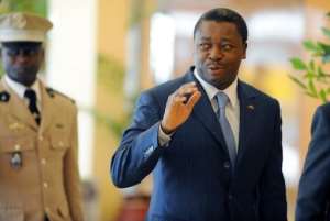 Togos President Faure Gnassingbe waves on November 11, 2012 in Abuja.  By Pius Utomi Ekpei (AFP/File)