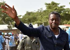 Togo's President Faure Gnassingbe, candidate for his re-election, greets supporters during a presidential campaign meeting in Togblekope, near Lome, on April 22, 2015.  By Issouf Sanogo AFP