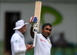 Sri Lanka's Mahela Jayawardene celebrates after scoring a century 100 runs during the opening day of the second Test against South Africa at the Sinhalese Sports Club SSC Ground in Colombo, on July 24, 2014.  By Lakruwan Wanniarachchi AFP