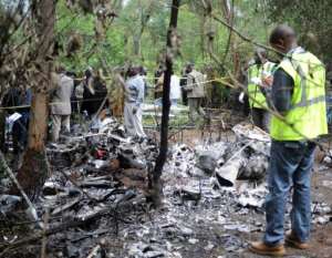 Kenyan forensic experts collect evidence at the site of the crash.  By Simon Maina AFP