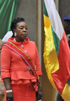 Central African Republics new interim president Catherine Samba Panza stands in front of the countrys national flag after her swearing-in ceremony in Bangui on January 23, 2014. By Issouf Sanogo (AFP)
