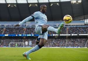 Manchester City's Ivorian midfielder Yaya Toure controls the ball during a English Premier League football match against Swansea City in Manchester, England, on November 22, 2014.  By Oli Scarff AFPFile